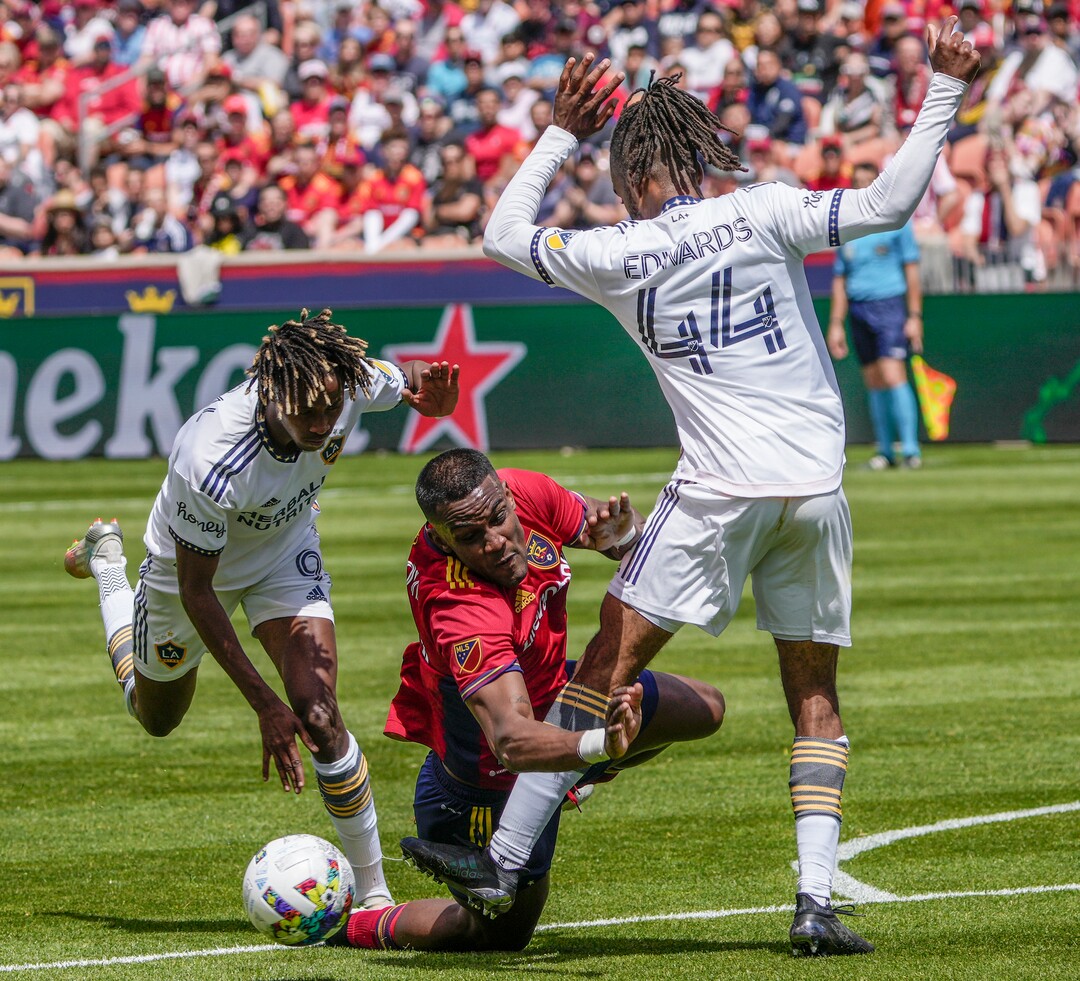 (Leah Hogsten | The Salt Lake Tribune)  Real Salt Lake forward Sergio Córdova (10) falls between Los Angeles Galaxy forward Kévin Cabral (9) and Los Angeles Galaxy forward Raheem Edwards (44) as Real Salt Lake hosts LA Galaxy at Rio Tinto Stadium, Saturday, April 30, 2022.