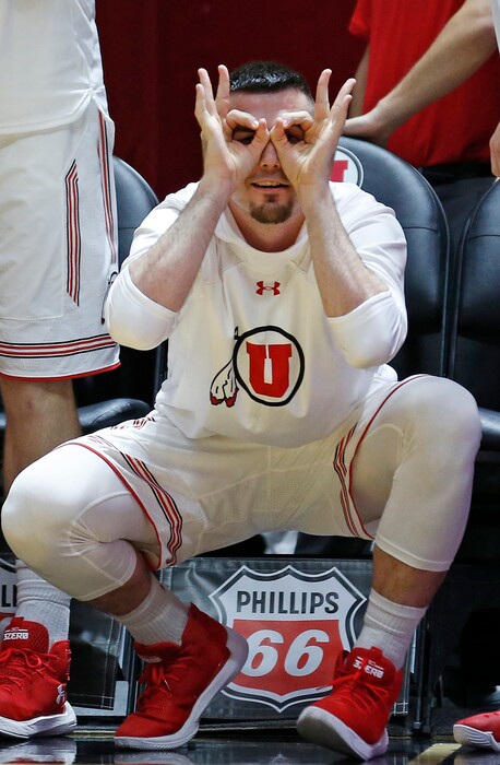 Utah guard Beau Rydalch celebrates from the bench after a teammate scored a three-point basket against Washington State in the second half during an NCAA college basketball game Sunday, Jan. 21, 2018, in Salt Lake City. (AP Photo/Rick Bowmer)