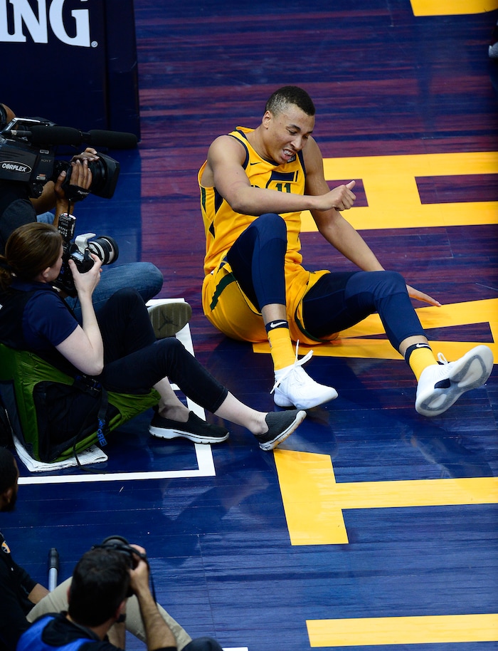 (Scott Sommerdorf | The Salt Lake Tribune)
Utah Jazz guard Dante Exum (11) recoils after hurting his arm after he rolled out of bounds during first half play. The Rockets led the Jazz 58-48 at the half, Sunday, May 6, 2018.