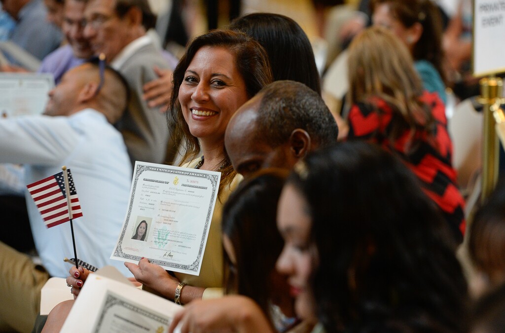 Francisco Kjolseth | The Salt Lake TribuneGissou Ceron of Mexico proudly holds her new certificate of U.S. citizenship during a ceremony at the Utah Capitol on Friday, Sept. 30, 2016. The U.S. Citizenship and Immigration Services hosted a naturalization ceremony for 132 citizenship applicants from 49 countries.