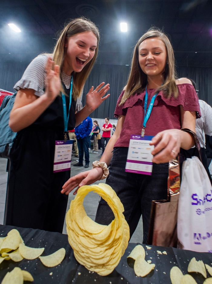 (Rick Egan  |  The Salt Lake Tribune)         Claire Cannady and Hanna Phelps build an arch out of potato chips, during the SheTech Explorer Day event, at the Mountain America Expo Center in Sandy, Tuesday, April 9, 2019.