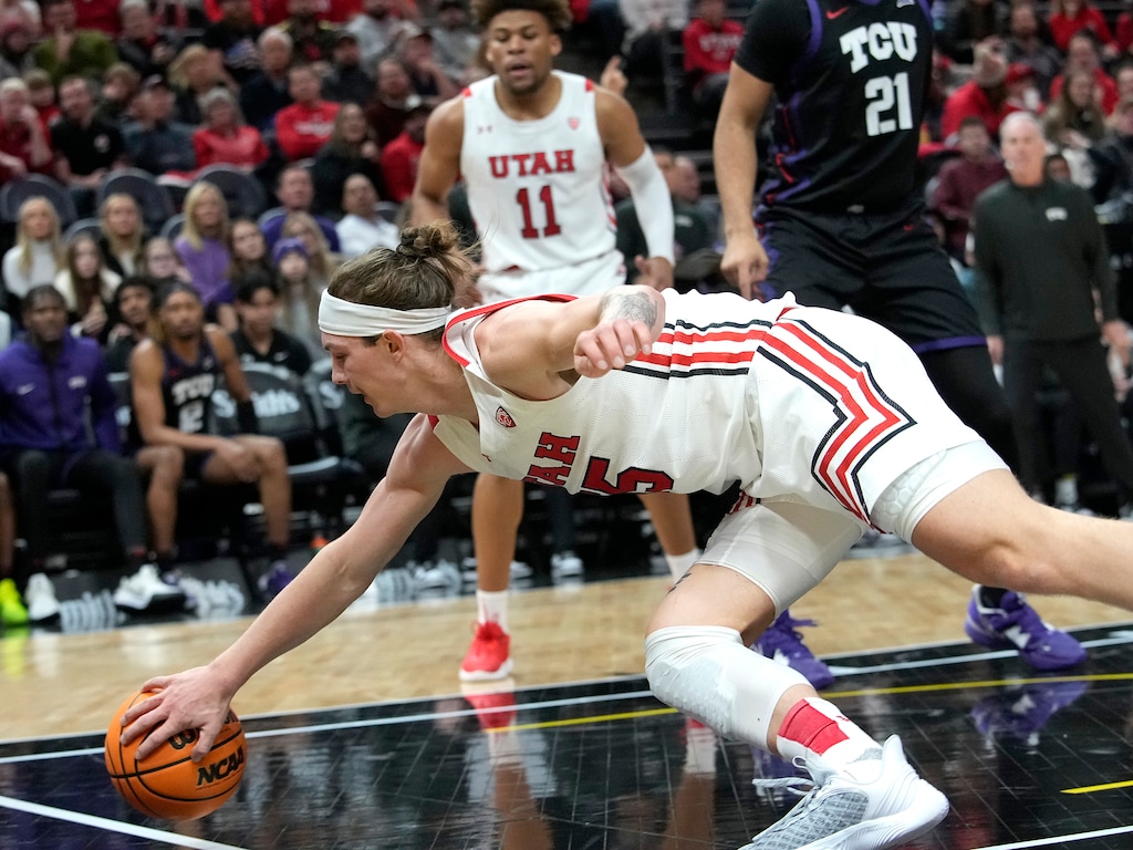 (Leah Hogsten | The Salt Lake Tribune) Utah Utes guard Gabe Madsen (55) fails to make the save as the University of Utah hosts the TCU Horned Frogs at Vivint Arena, Dec. 21, 2022. 