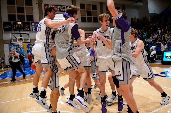 (Trent Nelson | The Salt Lake Tribune) Lehi players celebrate a win over Farmington High School in the 5A boys basketball state championship game, in Taylorsville on Saturday, March 6, 2021.