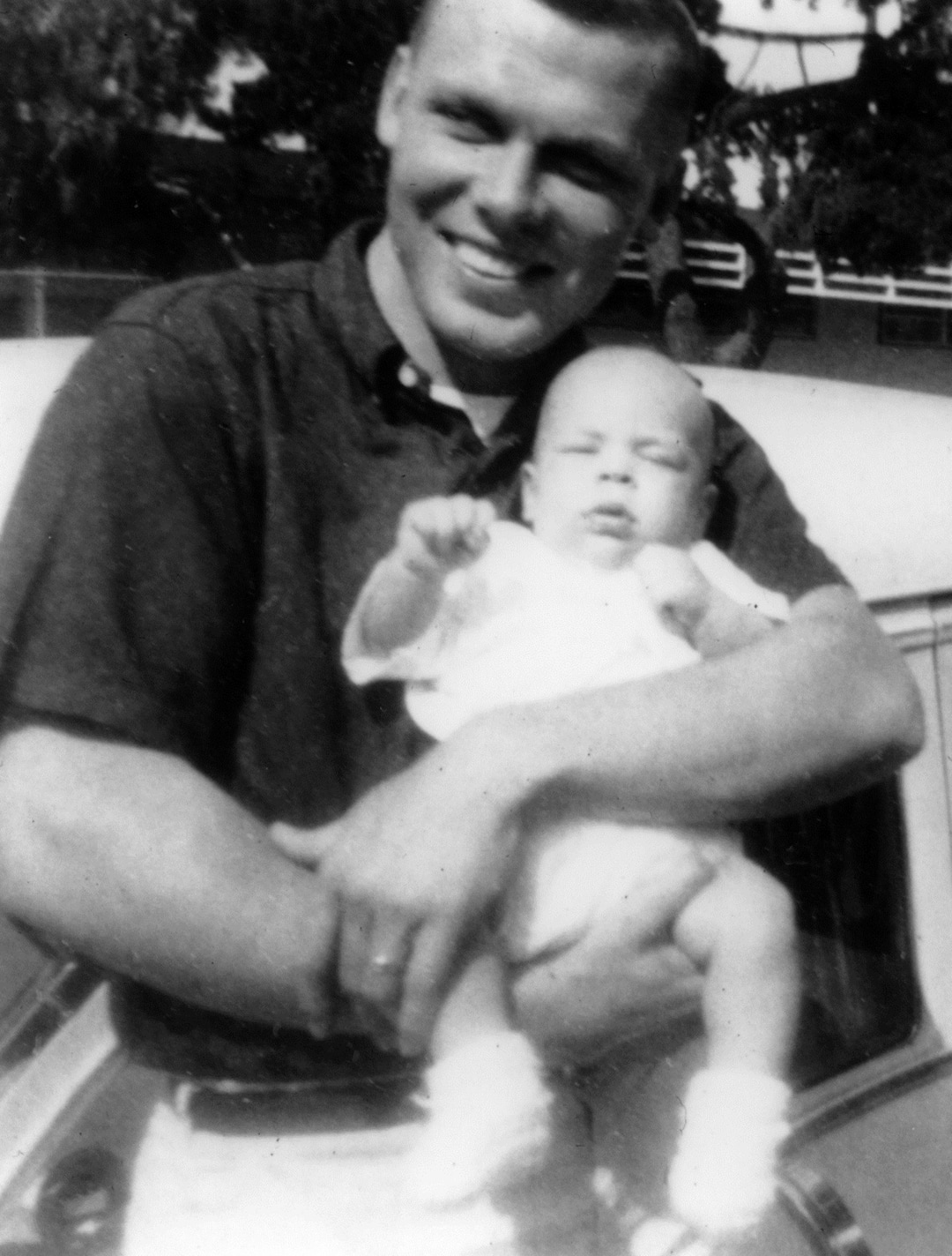 (photo courtesy Huntsman family) Jon Huntsman cradles his son, Jon Huntsman, Jr., in this photo from 1960.