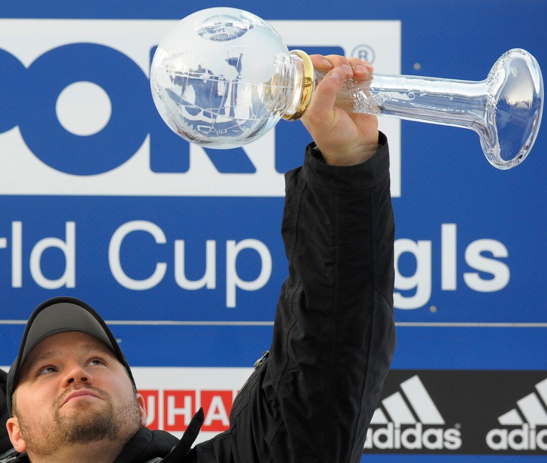 Team USA 1 pilot Steven Holcomb holds the winner trophy during the World Cup winner ceremony of the 4-men Bob World Cup competition in Innsbruck Igls, Austria, on Sunday Jan. 24, 2010. The Team USA 1 won the World Cup overall. (AP Photo/Christof Stache)