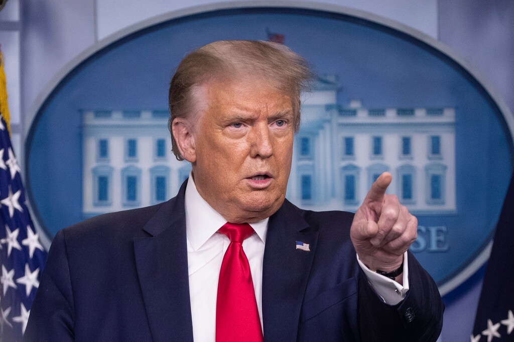 FILE - President Donald Trump points to a question as he speaks during a briefing with reporters in the James Brady Press Briefing Room of the White House, in Washington. Trump’s demand that the U.S. government get a cut of Microsoft buying TikTok is the latest unprecedented scenario in an unprecedented situation. Microsoft is in talks to buy parts of TikTok, a forced sale after Trump threatened to ban the Chinese-owned video app, which has one hundred million U.S. users and hundreds of millions globally. (AP Photo/Alex Brandon)