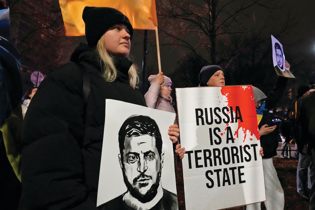People hold a demonstration in support of Ukraine outside the U.S. Embassy in Warsaw, Poland, on Monday March 3, 2025. (AP Photo/Czarek Sokolowski)
