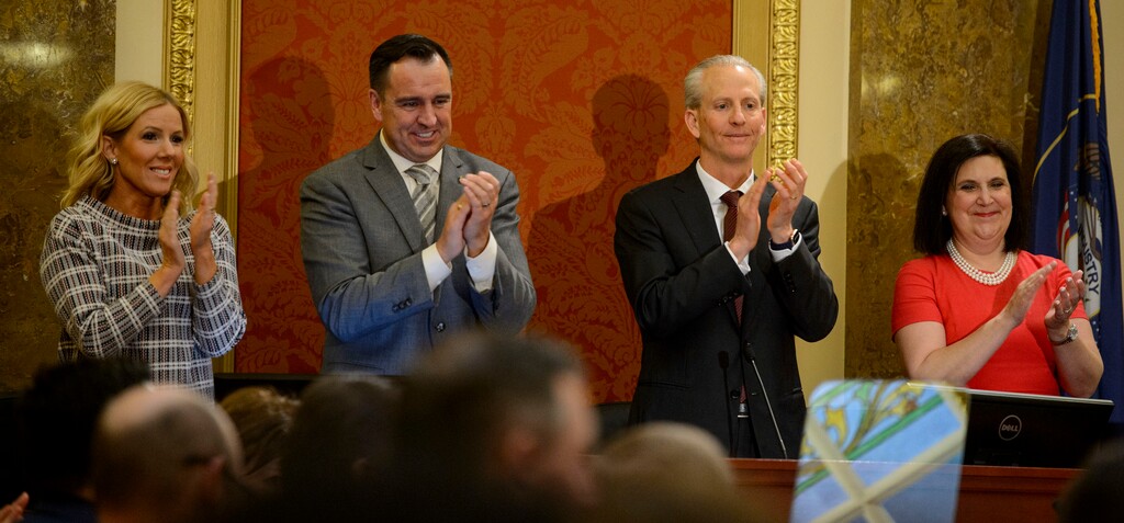 (Steve Griffin  |  Tribune file photo) Speaker of the House Greg Hughes and his wife Krista, left, and Senate President Wayne Niederhauser and his wife Melissa, stand and applaud as Gov. Gary Herbert and first lady Jeanette Herbert enter the Utah House of Representatives prior to the governor's State of the State address in Salt Lake City, Jan. 24, 2018.