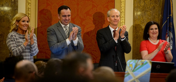 (Steve Griffin  |  The Salt Lake Tribune) Speaker of the House Greg Hughes and his wife Krista, left, and Senate President Wayne Niederhauser and his wife Melissa, stand and applaud as Gov. Gary Herbert and First Lady Jeanette Herbert enter the Utah House of Representatives prior to the governor's State of the State address in Salt Lake City Wednesday January 24, 2018.