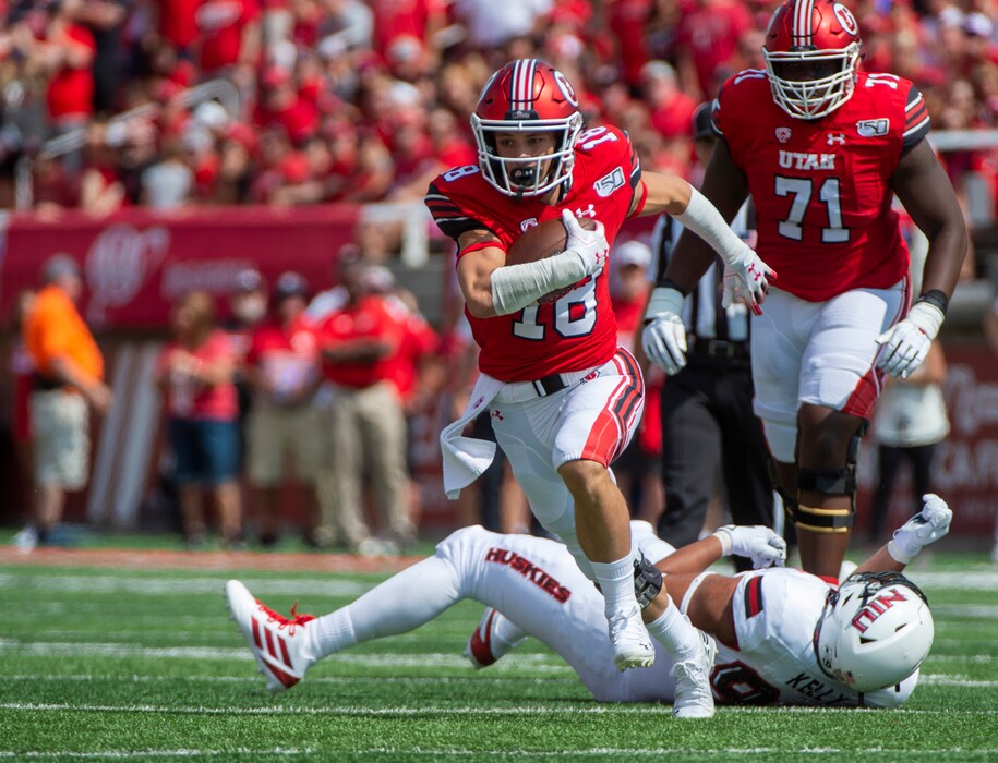(Rick Egan  |  The Salt Lake Tribune)    Utah wide receiver Britain Covey (18) breaks a tackle and heads down field for the Utes, in football action between Northern Illinois Huskies and Utah Utes at Rice-Eccles Stadium, Saturday, Sept. 7, 2019.