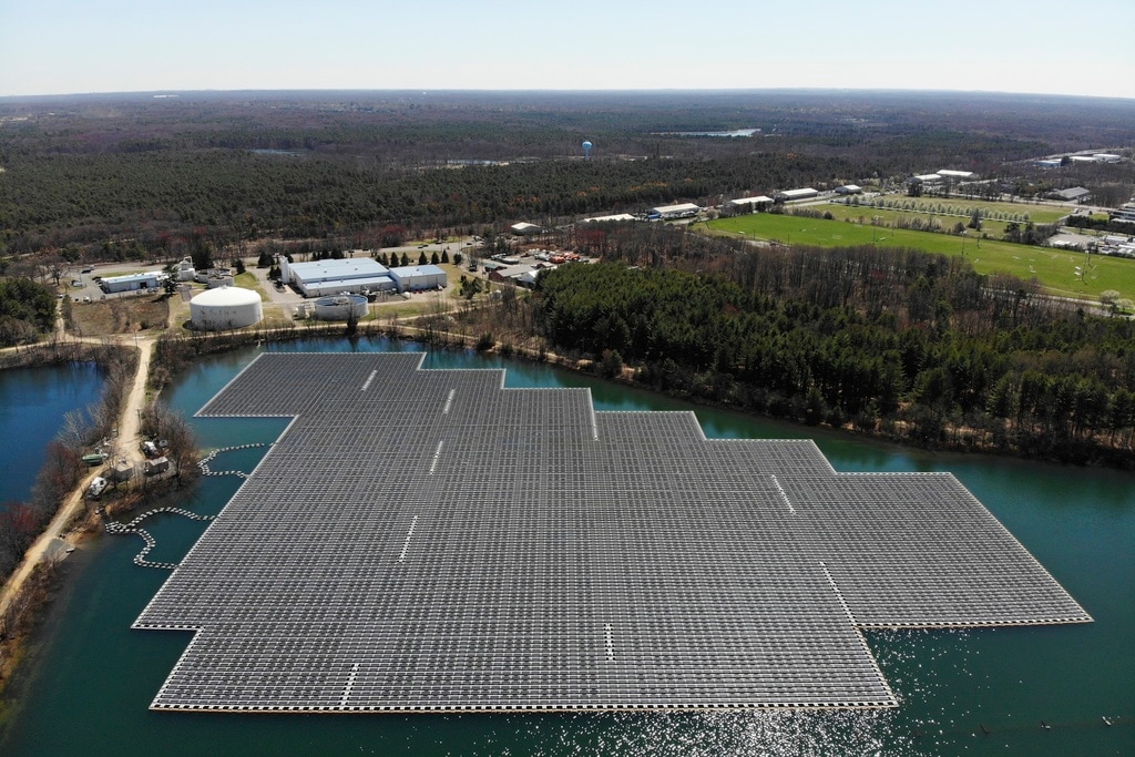 (Seth Wenig | AP Photo) An array of solar panels float on top of a water storage pond in Sayreville, N.J., Monday, April 10, 2023. Floating solar panel farms are beginning to boom in the United States after rapid growth in Asia. They're attractive not just for their clean power and lack of a land footprint, but because they also conserve water by preventing evaporation.