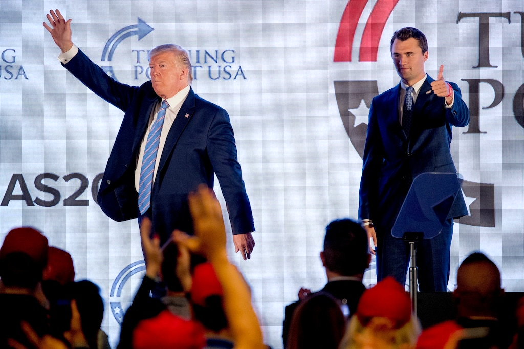President Donald Trump is joined on stage with Turning Point USA Founder Charlie Kirk as he finishes speaking at Turning Point USA Teen Student Action Summit at the Marriott Marquis in Washington, Tuesday, July 23, 2019. (AP Photo/Andrew Harnik)