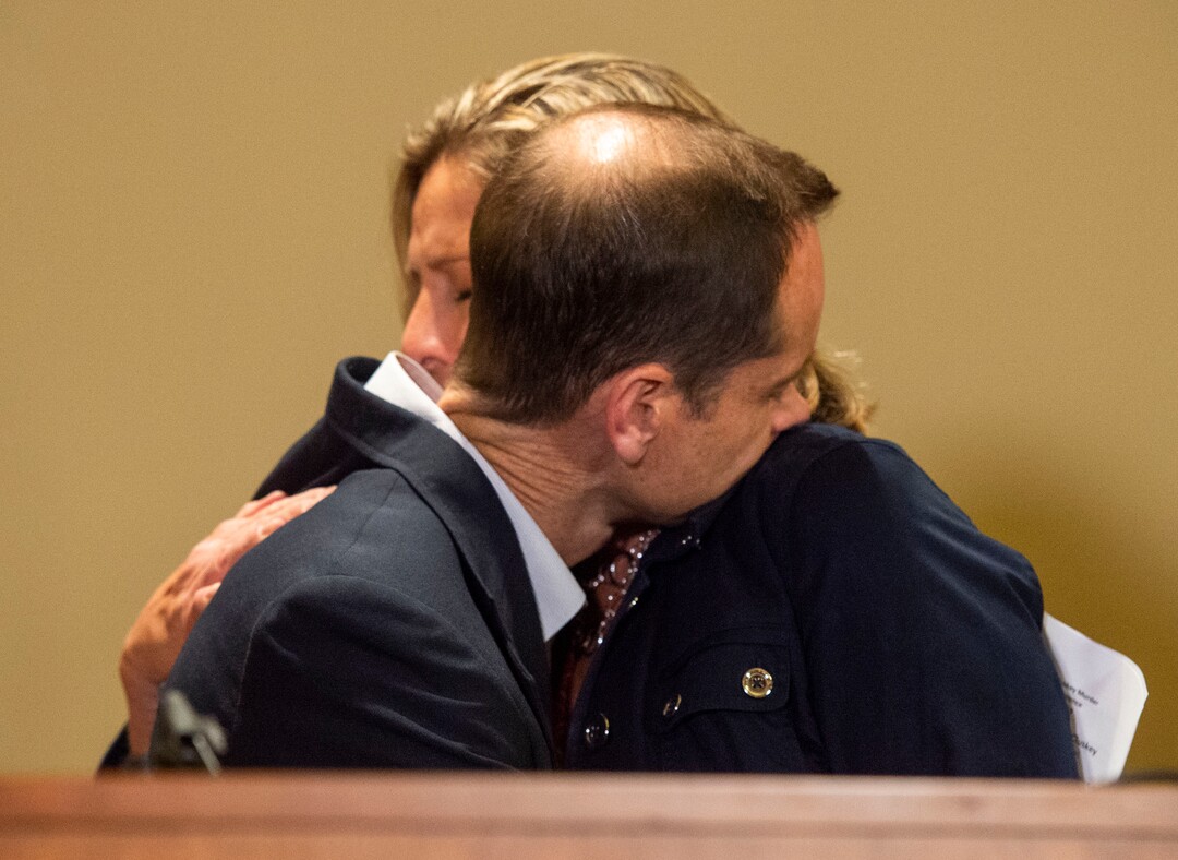 (Rick Egan | The Salt Lake Tribune) Jill McCluskey hugs her husband Matt McCluskey  after speaking at a news conference Thursday, June 27, 2019, following the filing of a lawsuit against the University of Utah for $56 million, alleging campus police could have done more to prevent the murder of their daughter Lauren.