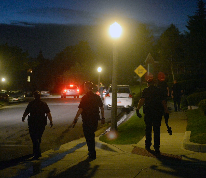 (Al Hartmann  |  Tribune file photo) In this 2014 file photo, Utah Division of Natural Resources and Salt Lake City Police search the neighborhood near 2500 East and 1500 South for a mountain lion spotted in the area.
