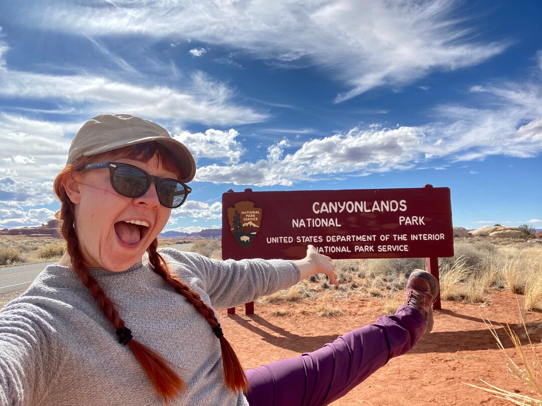 (Emily Pennington  |  Little A) Emily Pennington at the entrance to Canyonlands National Park. Pennington has written a memoir, "Feral," about her experience visiting all the national parks in the United States.