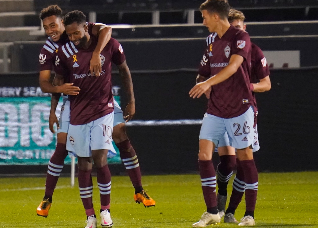 Colorado Rapids forward Jonathan Lewis, left, celebrates scoring a goal with midfielders Kellyn Acosta and Cole Bassett (26) during the second half of an MLS soccer match against the San Jose Earthquakes on Wednesday, Sept. 23, 2020, in Commerce City, Colo. The Rapids won 5-0. (AP Photo/David Zalubowski)