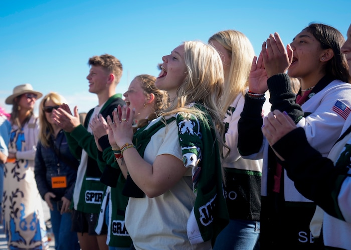 (Bethany Baker | The Salt Lake Tribune) Payson High School student cheer as Keving Bacon speaks at a charity event to commemorate the 40th anniversary of the movie "Footloose" on the football field of Payson High School in Payson on Saturday, April 20, 2024.