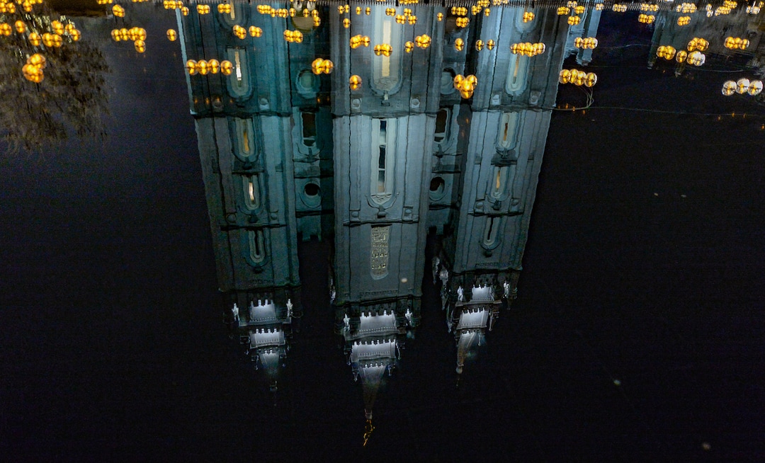 (Francisco Kjolseth  |  The Salt Lake Tribune)  Visitors take in the sights as Temple Square in Salt Lake City comes to life Friday, November 29, 2019, as hundreds of thousands of colorful LED bulbs light up, a yearly tradition that started in 1965. The lights will run through the end of the year.