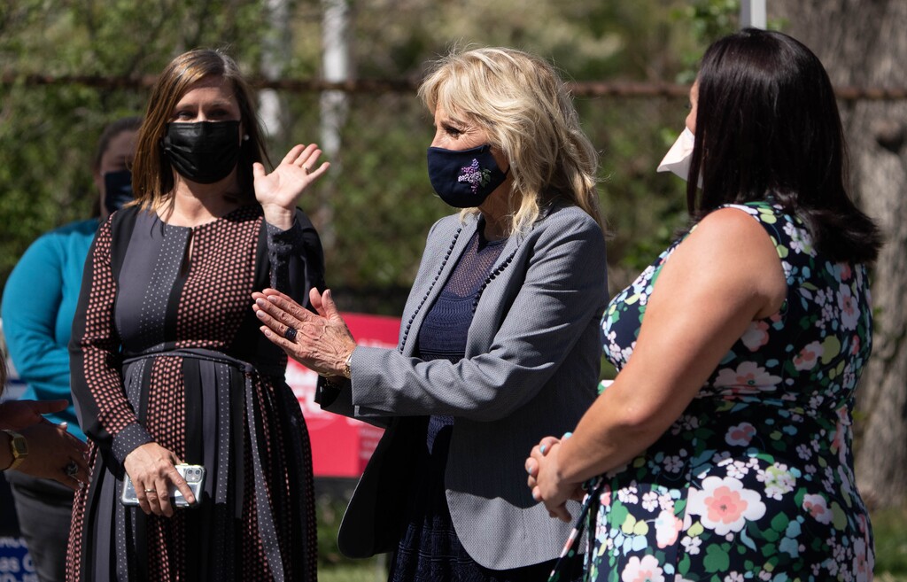 (Francisco Kjolseth | The Salt Lake Tribune) Utah County Mayor Jenny Wilson, left, and Rep. Angela Romero, D-Salt Lake, at right join first lady Jill Biden as she visits a pop-up COVID-19 vaccine clinic in Jordan Park on Salt Lake City’s west side on Wednesday, May 5, 2021.