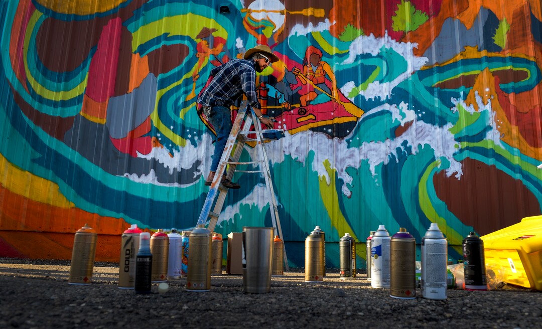 (Leah Hogsten | The Salt Lake Tribune) Muralist Matt Monsoon paints on the wall of the Commonwealth Room during the 2nd annual Mural Fest sponsored by South Salt Lake Arts Council and Utah Arts Alliance. Ten murals were created in South Salt Lake's community between 2100 and 2400 South off of West Temple, May 11, 2019.