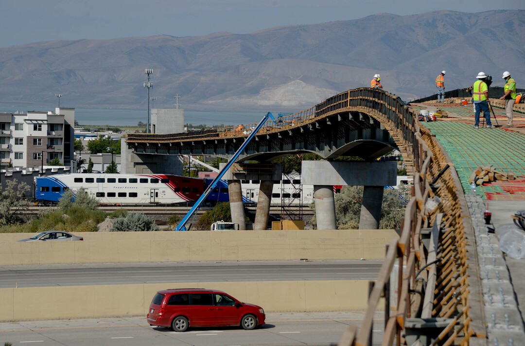 (Francisco Kjolseth  |  The Salt Lake Tribune) UDOT gives a tour of the state’s new longest pedestrian bridge on Thursday, August 20, 2020, connecting Utah Valley University in Orem to student housing and the community on the West side of I-15. Crews are finishing up an extensive hydronic heating system that will pump warm water to keep the bridge clear of snow in the winters, as it gets ready to pour concrete for the walking surface. UDOT will close I-15 in both directions this weekend for work on the nearly 1,000 foot bridge that is 15 feet wide to accommodate pedestrians, cyclists and scooters. Elevators and stairs with small ramps to push up bicycles will be on each side of the bridge.
