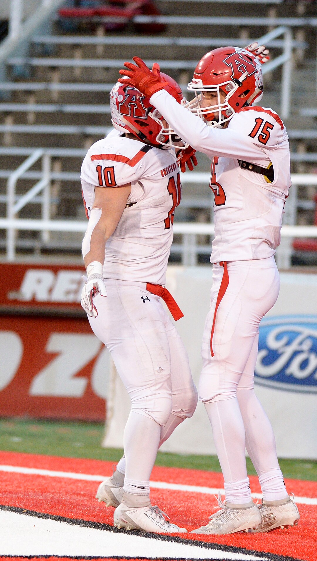 (Leah Hogsten  |  The Salt Lake Tribune)  American ForkÕs Jaxon Gregory celebrates Devin DowningÕs touchdown. Corner Canyon High School defeated American Fork High School 49-14 during the 6A State Championship football title, Nov. 22, 2019 at Rice-Eccles Stadium.