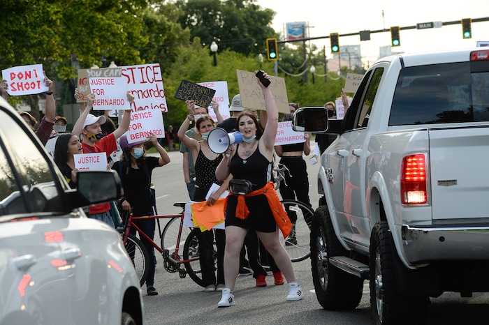 (Francisco Kjolseth  |  The Salt Lake Tribune) Sofia Alcala leads the crowd as they chant during a Rally for Bernardo Palacios, in front of the Salt Lake County District Attorney's office and block traffic along 500 S. on Thursday, June 18, 2020.