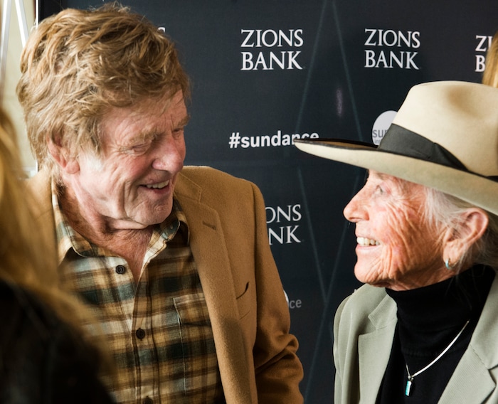 (Rick Egan  |  The Salt Lake Tribune)    Heidi Redd, a San Juan County conservationist, visits with Robert Redford, before receiving an award for her leadership, at the 2018 Sundance Film Festival Utah Women’s Leadership Celebration in Park City on Thursday, Jan. 25, 2018.