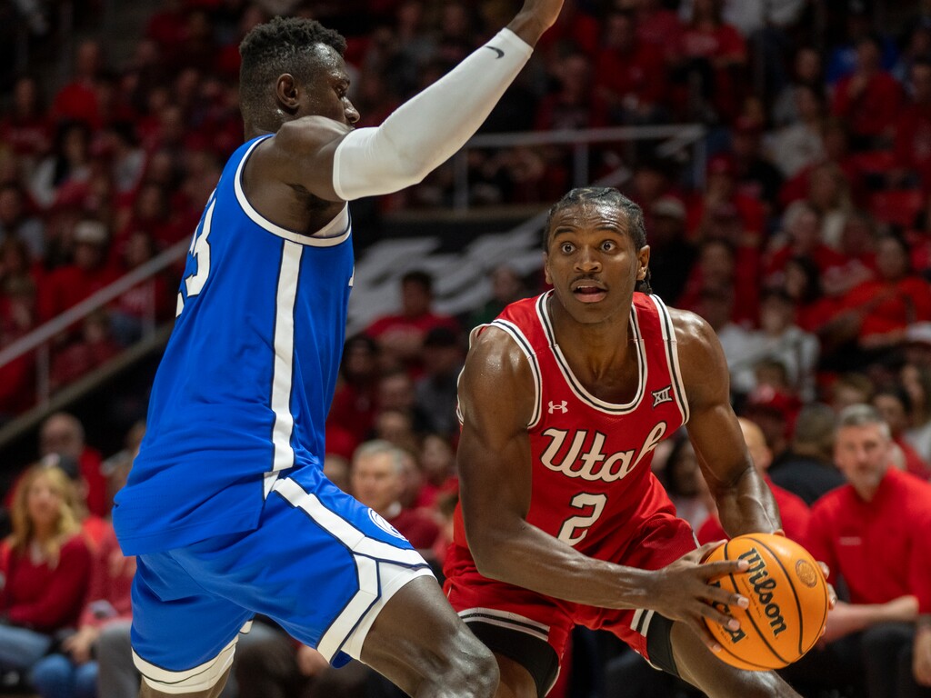 (Rick Egan | The Salt Lake Tribune) Utah Utes forward Ezra Ausar (2) looks for a shot as Brigham Young Cougars center Keba Keita (13) defends, in Big 12 basketball action between the Utah Utes and the Brigham Young Cougars, at the Jon M. Huntsman Center, on Saturday, Jan 18, 2025.