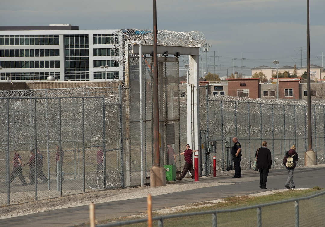 (Leah Hogsten  |  The Salt Lake Tribune) As she slips back into the prison yard after working a shift at the cafe, Chonsey Leslie waves goodbye to her two supervisors. Every Monday through Friday, a half-dozen or so Level 4 inmates file out of the Olympus Facility at the Utah State Prison to cook, bake and serve the public at the Serving Time Caf. The operation is part of Utah Department of Corrections Industries (UCI) and is aimed at helping inmates return to society.