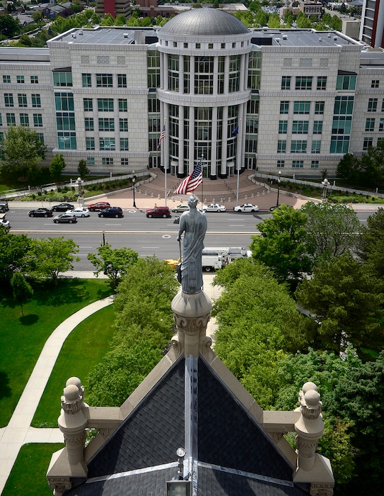 (Scott Sommerdorf | Tribune file photo)
The statue representing Justice looks west toward the Scott M. Matheson Courthouse as seen from the clock tower of the City and County Building during a tour of the building, May 26, 2016.