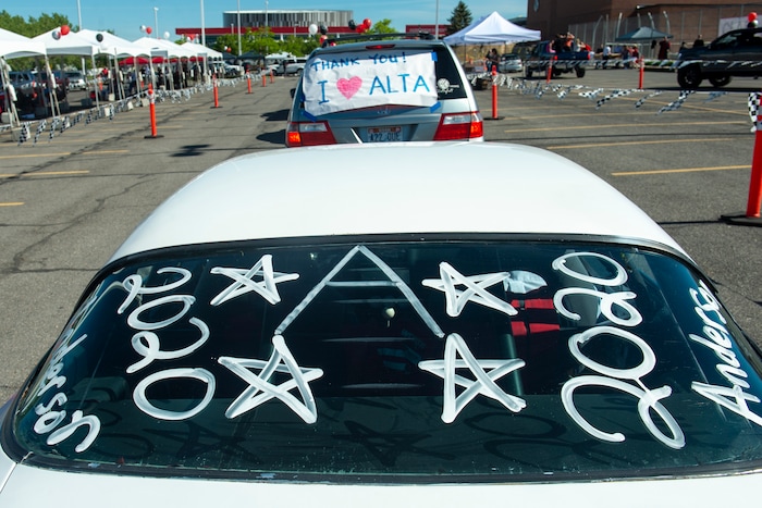 (Rick Egan  |  The Salt Lake Tribune)      Alta High parade of 2020 graduates  participate in a “drive through” graduation ceremony at Alta High, Thursday, May 28, 2020.