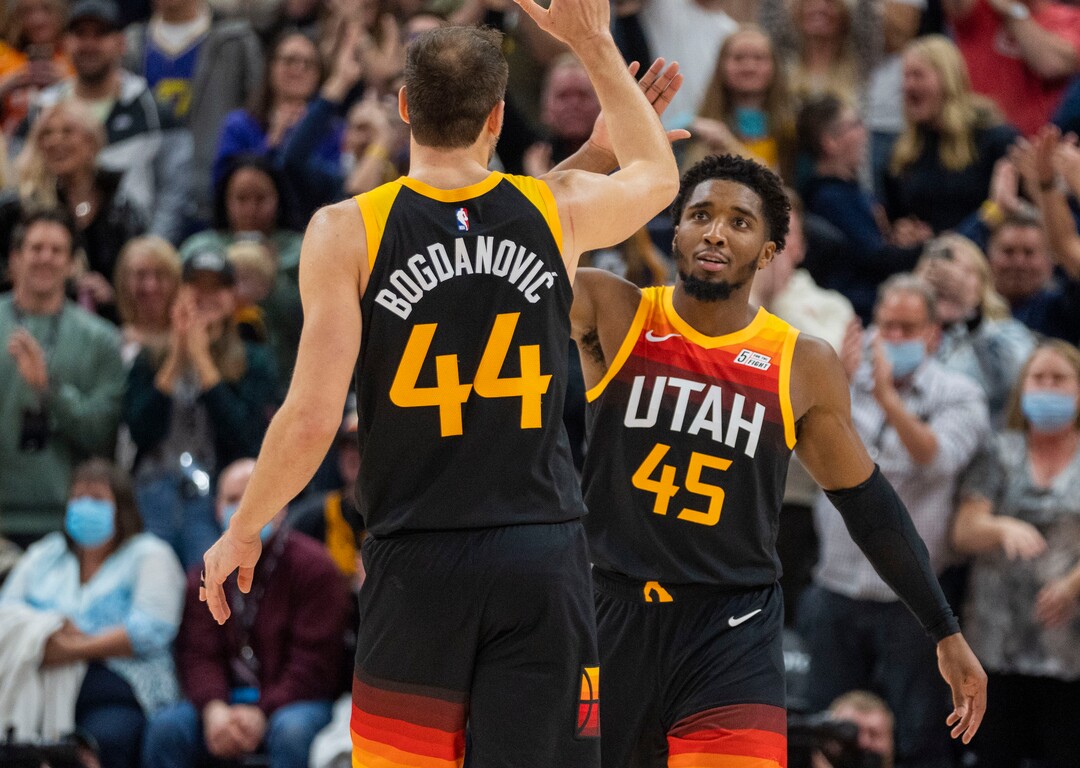 (Rick Egan | The Salt Lake Tribune) Utah Jazz forward Bojan Bogdanovic (44) high-five's Donovan Mitchell (45) as it appeared that he put the Jazz up by 6 points, 99-93 with 37 seconds left, the play was reviewed and the basket was taken away, in NBA action between the Utah Jazz and the New Orleans Pelicans, at Vivint Arena, in Salt Lake City, on Friday, Nov. 26, 2021.