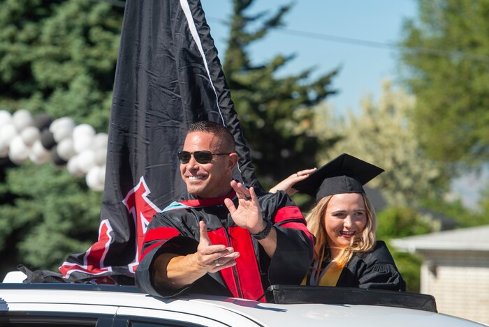 (Rick Egan  |  The Salt Lake Tribune)     Alta High principal, Brian McGill rides in the parade of 2020 graduates with his daughter Jody, in a “drive through” graduation ceremony at Alta High, Thursday, May 28, 2020.