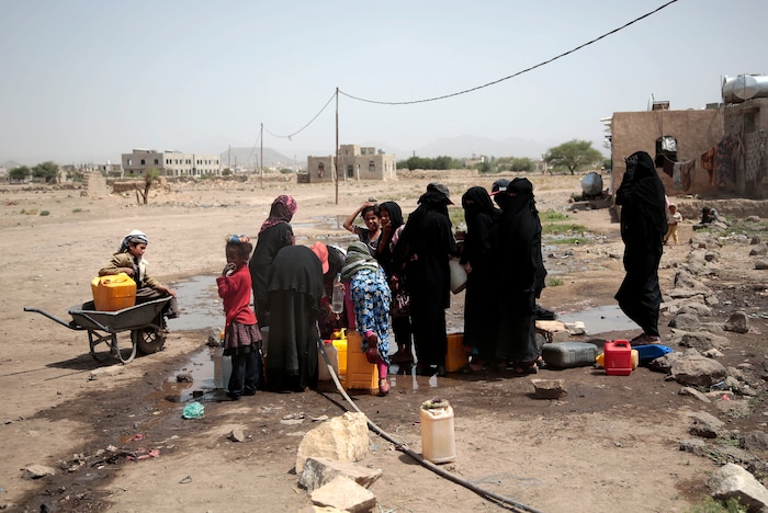 In this photo taken on Wednesday, Jul. 12, 2017, people fill buckets with water from a well that is alleged to be contaminated water with the bacterium Vibrio cholera, on the outskirts of Sanaa, Yemen. Yemen’s raging two-year conflict has served as an incubator for lethal cholera. (AP Photo/Hani Mohammed)
