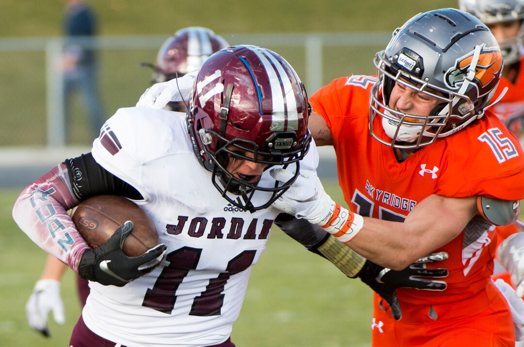 (Rick Egan  |  The Salt Lake Tribune)   Ty Arrington, Skyridge, brings down Jordan running back Jake Shaver (11) as he runs for a huge gain, in prep 5A playoff action between Jordan High and Skyridge High, in Lehi, Friday, Nov. 2, 2018.