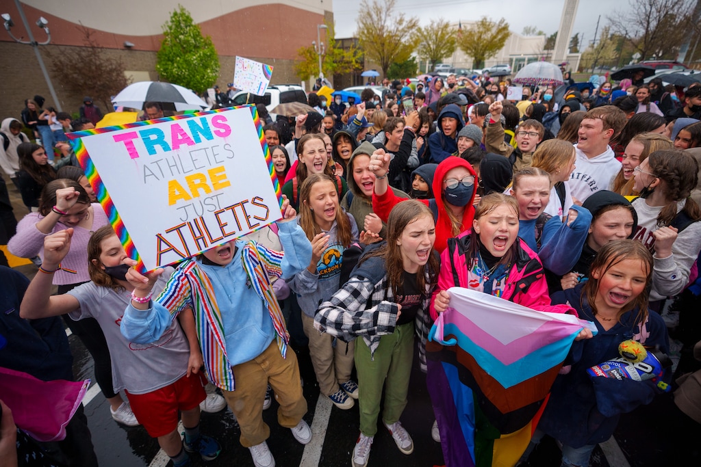 (Trent Nelson  |  The Salt Lake Tribune) Clayton Middle School students chant "Let them play!" during a walkout protesting HB 11, which bans transgender students from competing in sports, in Salt Lake City on Friday, April 22, 2022.