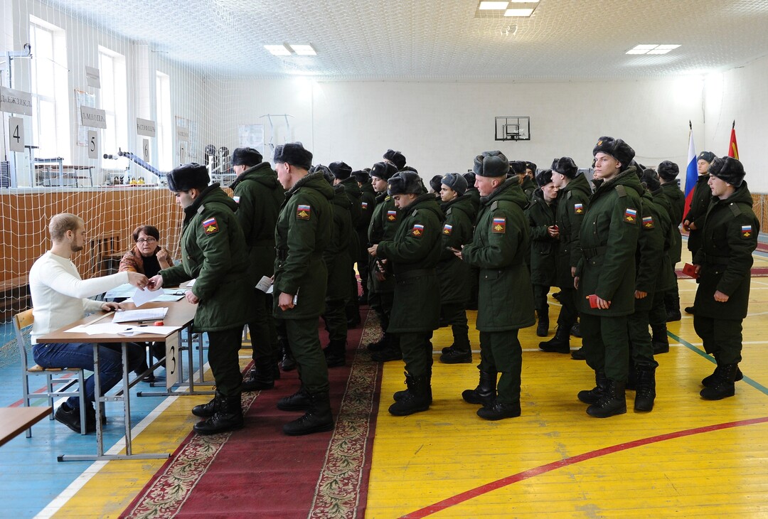 Russian soldiers line up to get their ballots in the presidential election in Rostov-ojn-Don, Russia, Sunday, March 18, 2018. Russia's presidential election was tainted Sunday by unprecedented pressure on voters to turn out and incidents of suspected ballot box stuffing, a barely democratic exercise that will grant Vladimir Putin another six years of power. (AP Photo)