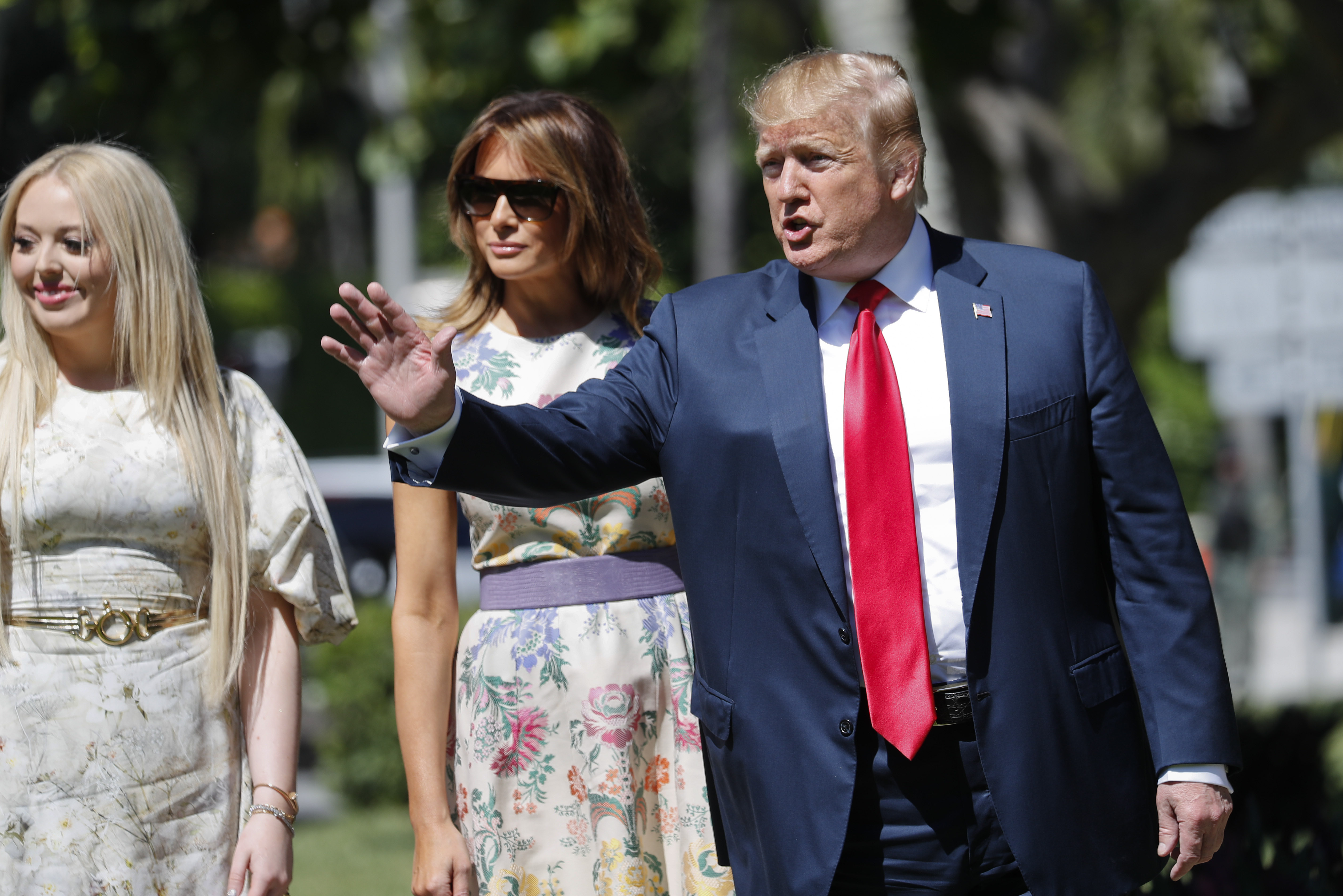 (AP Photo/Pablo Martinez Monsivais) President Donald Trump, right, with first lady Melania Trump, center, and daughter Tiffany Trump, left, arrive for Easter services at Episcopal Church of Bethesda-by-the-Sea, Sunday, April 21, 2019, in Palm Beach, Fla.