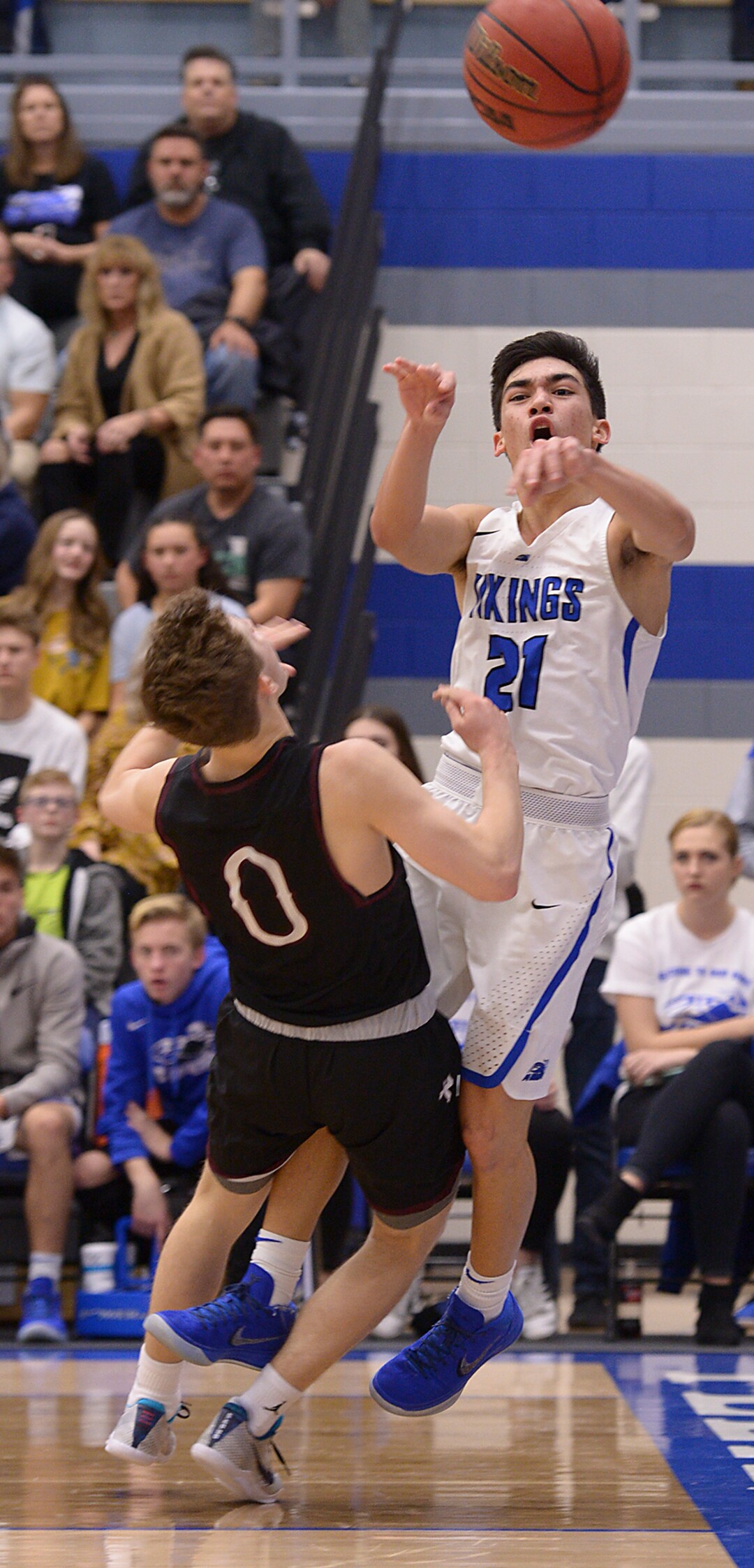 (Leah Hogsten  |  The Salt Lake Tribune)  Pleasant Grove's Kawika Akina is fouled by Lone Peak's Chantry Ross.  Lone Peak High School boys' basketball team defeated Pleasant Grove High School 65-61 during their game Friday, January 26, 2018 in Pleasant Grove. 