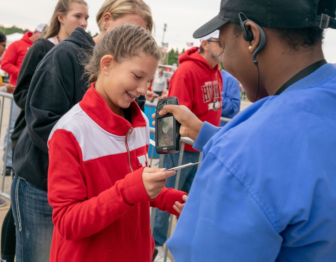 Ashlyn Owens, 10, of Maumee Ohio the niece of the Utah Utes assistant coach Jim Harding gets her ticket scanned before the start of a college football game between the Northern Illinois Huskies and the Utah Utes at Huskie Stadium in DeKalb, IL on Saturday, Sept. 08, 2018 (Sean King | for The Salt Lake Tribune)