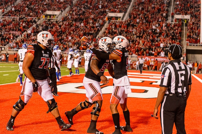 (Trent Nelson | The Salt Lake Tribune) Utah Utes wide receiver Darren Carrington II (9, right) and Utah Utes offensive lineman Lo Falemaka (69) celebrate a touchdown as the Utah Utes host the San Jose State Spartans, NCAA football at Rice-Eccles Stadium in Salt Lake City, Saturday September 16, 2017.