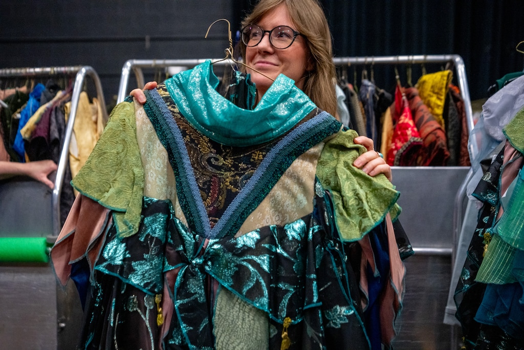 (Trent Nelson  |  The Salt Lake Tribune) Mallory Goodman with costumes set to be sold on Aug. 15 in Utah Opera's Costumes, Props, & Scenic Elements Sale, in Salt Lake City, as photographed on Tuesday, Aug. 11, 2026.