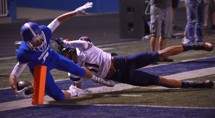 Leah Hogsten | The Salt Lake Tribune
Bingham's Brayden Cosper makes a touchdown in the final seconds of the game over the defense of Bishop Gorman's Damuzhea Bolden. Bishop Gorman defeated Bingham 38-20. Nationally No. 7-ranked Bingham High School hosted No. 1-ranked Bishop Gorman High School from Nevada, September 4, 2015.