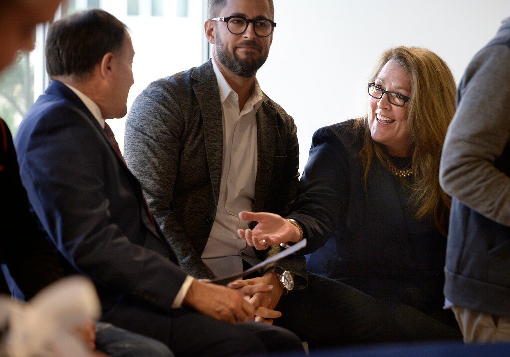 ( Scott Sommerdorf | Tribune file photo ) Silicon Slopes board member Carine Clark, right, speaks with Utah Gov. Gary Herbert prior to a May 2017 ribbon-cutting ceremony at the new Lehi headquarters for Silicon Slopes, a nonprofit that promotes the growth of high tech business in Utah.