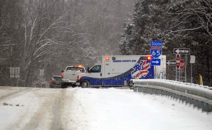 A Hardin County (Kentucky) EMS units leaves the scene of a multi-vehicle wreck on Interstate 65 near the Bonnieville, Kentucky exit on Tuesday, Jan. 16, 2018 enroute to an area hospital with patients.  (Neal Cardin/The News-Enterprise via AP)