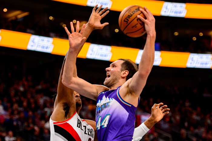 (Trent Nelson  |  The Salt Lake Tribune) Utah Jazz forward Bojan Bogdanovic (44) defended by Portland Trail Blazers center Hassan Whiteside (21) as the Utah Jazz host the Portland Trail Blazers, NBA basketball in Salt Lake City on Thursday, Dec. 26, 2019.