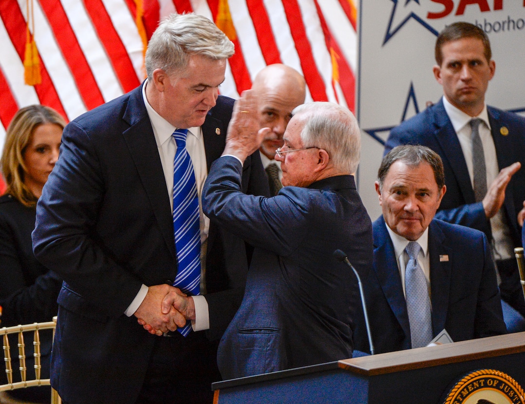 Leah Hogsten  |  The Salt Lake Tribune  U.S. Attorney General Jeff Sessions pats U.S. Attorney John W. Huber on the shoulder after Sessions' speech touting Project Safe Neighborhoods, Wednesday, October 3, 2018, at the Utah Capitol. Wednesday marks the one year anniversary since the Trump administration returned to the policy pushed by the George W. Bush administration. Under Project Safe Neighborhoods, federal prosecutors focus on security stiff sentences for those convicted of gun crimes and reducing violent crimes.