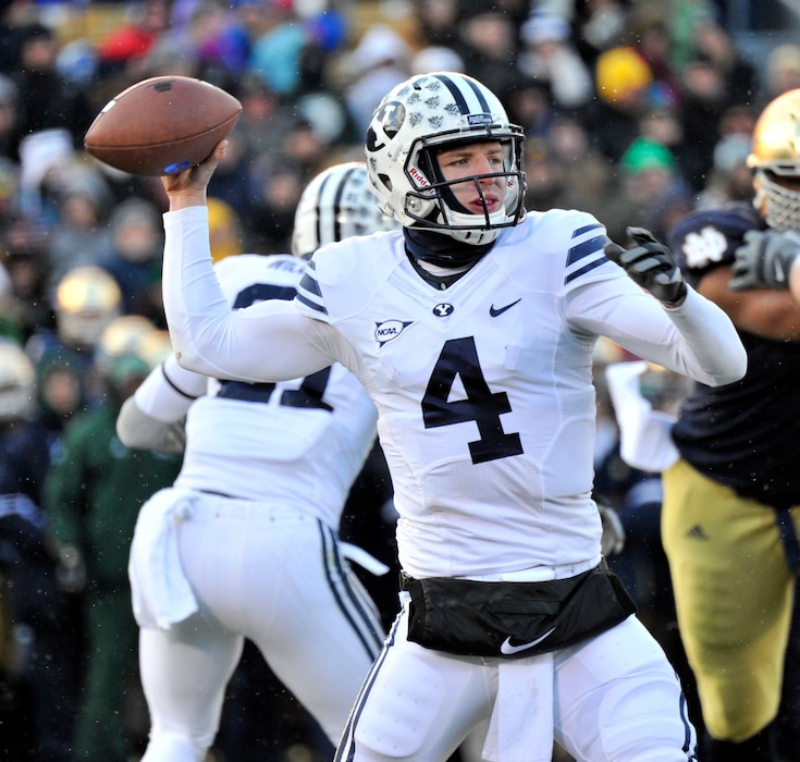 Brigham Young quarterback Taysom Hill throws a pass in the first half of an NCAA college football game Saturday, Nov. 23, 2013, in South Bend, Ind. (AP Photo/Joe Raymond)