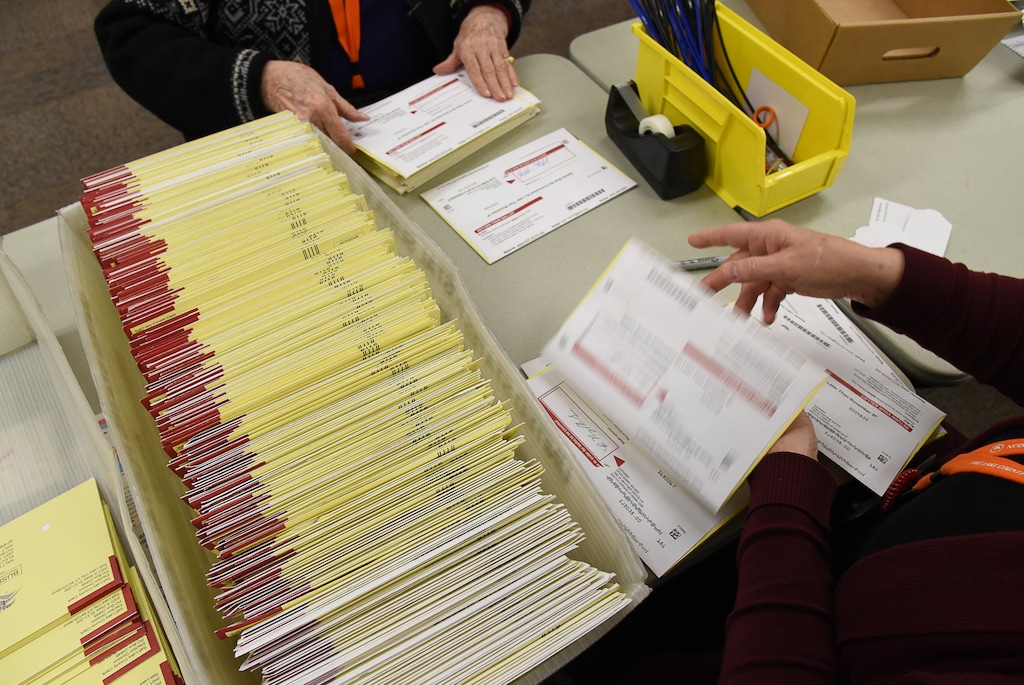 (Francisco Kjolseth  |  Tribune file photo)  Temporary elections workers begin the process of sorting through mailed-in ballots on Tuesday, Oct. 30, 2018. Voter fraud in Utah is extremely rare, Lt. Gov Spencer Cox recently reassured a man who asked him about the integrity of the state’s elections.